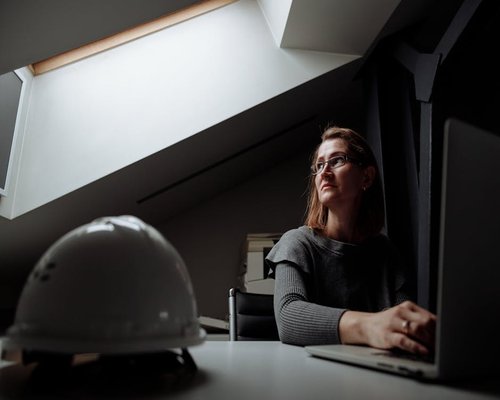 A professional working calmly at a structured desk workspace with proper lighting in Chile