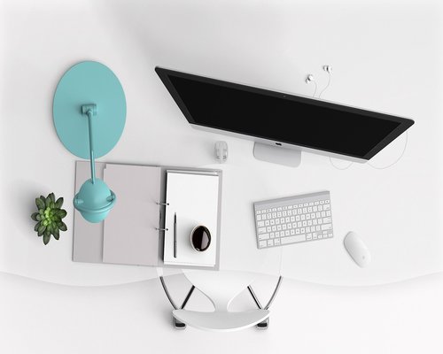 A neat minimalistic study area emphasizing natural side lighting and clean surface organization