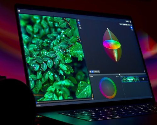Close up of a laptop display with customized mild warm color calibration profile during daytime